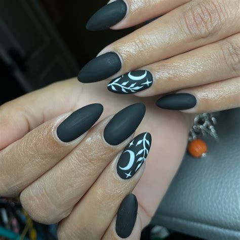 black matte celestial nail art.